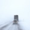 car-behind-truck-on-snowy-road